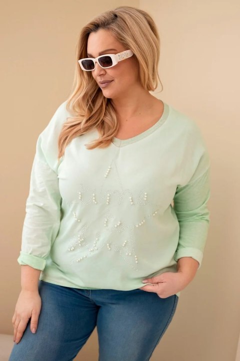 Bluzka damska Plus Size przecierana z napisem i perełkami miętowa
